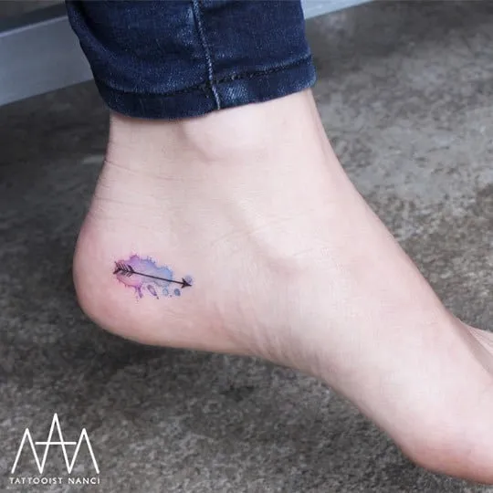 Watercolor Splash and Arrow Tattoo by Tattooist Nanci