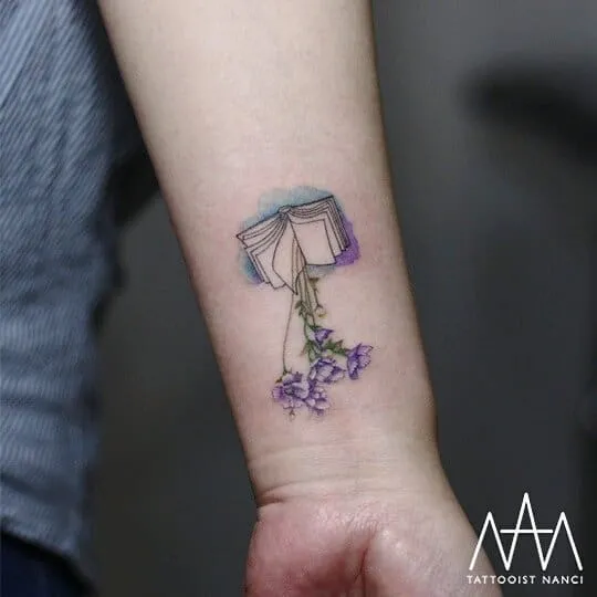 Book and Baby's Breath Tattoo by Tattooist Nanci