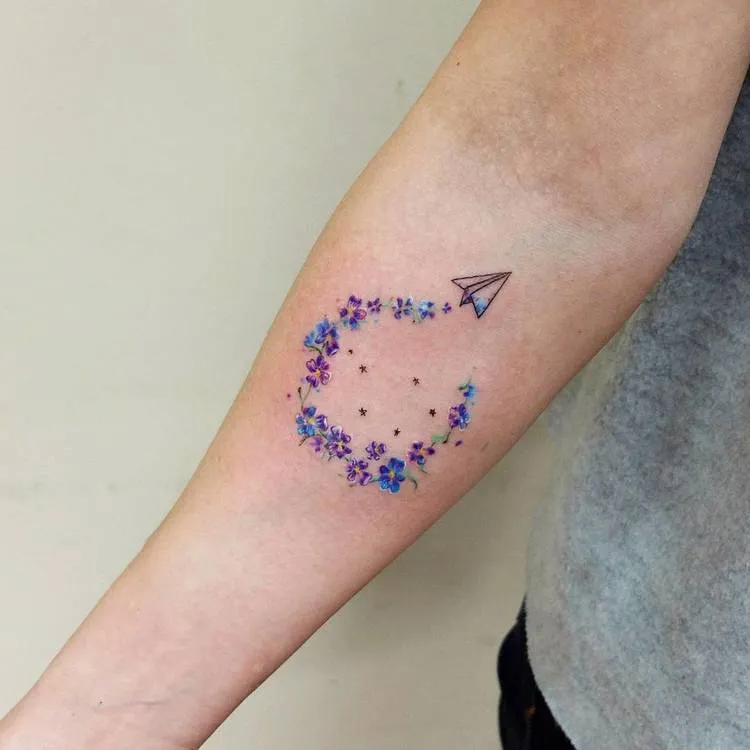 Small Paper Plain and Floral Trail Tattoo by Vitaly Kazantsev