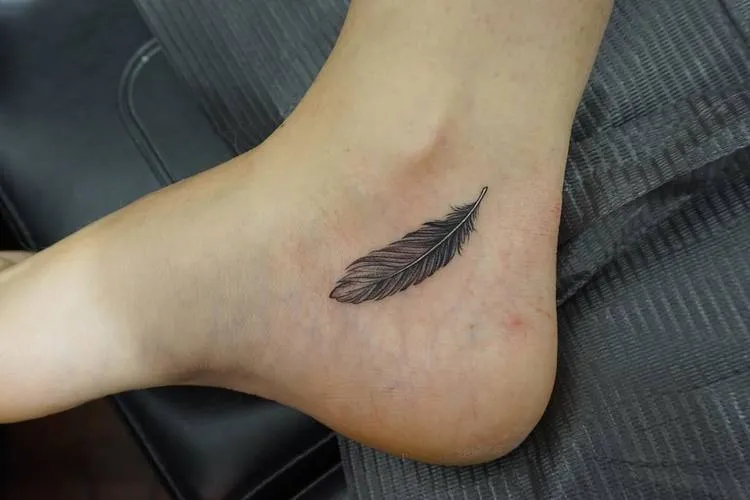 Feather Tattoo by mnsantanatattoo