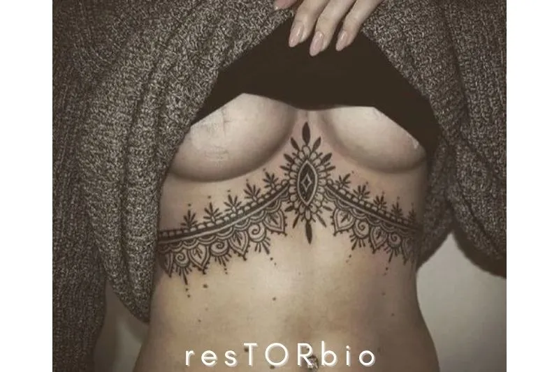 Traditional Henna-Inspired Under Boob Tattoo