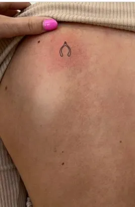 What Does a Wishbone Tattoo Mean, What does a broken wishbone mean, What's the meaning of wishbone, What does the wishbone mean in love, Why is Furcula called wishbone, Is a wishbone good luck, Why is breaking a wishbone good luck, What are the symbols of a wishbone, Wishbone tattoo placement, Wishbone tattoo with flowers,