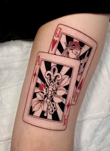 What Does Queen of Hearts Tattoo Mean, What does Queen tattoo mean, What does the two of Hearts tattoo mean, Queen of Hearts Tattoo, Minimalist Queen of Hearts Design, What does the Queen of Hearts tattoo represent, What are some common designs for a Queen of Hearts tattoo, What does the Queen of Hearts symbolize in tarot, What is the meaning of a two of hearts tattoo, What is the symbolism behind the Queen of Hearts tattoo,