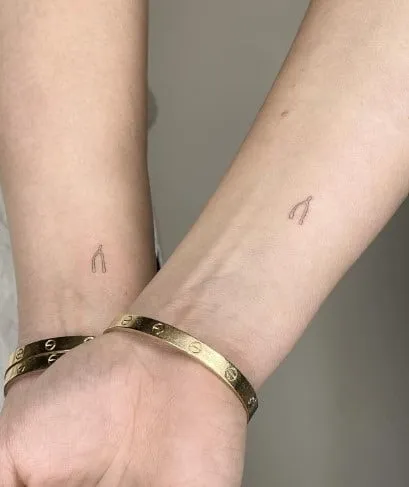 What Does a Wishbone Tattoo Mean, What does a broken wishbone mean, What's the meaning of wishbone, What does the wishbone mean in love, Why is Furcula called wishbone, Is a wishbone good luck, Why is breaking a wishbone good luck, What are the symbols of a wishbone, Wishbone tattoo placement, Wishbone tattoo with flowers,