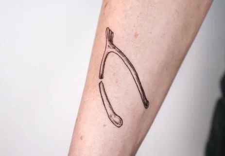 What Does a Wishbone Tattoo Mean, What does a broken wishbone mean, What's the meaning of wishbone, What does the wishbone mean in love, Why is Furcula called wishbone, Is a wishbone good luck, Why is breaking a wishbone good luck, What are the symbols of a wishbone, Wishbone tattoo placement, Wishbone tattoo with flowers,