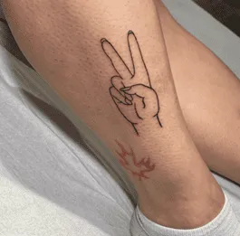 What Does A Peace Sign Tattoo Mean, Peace Sign Tattoo, Peace Sign Tattoo Ideas, Peace Sign Tattoo on fingers, Peace Sign Tattoo on Wrist,