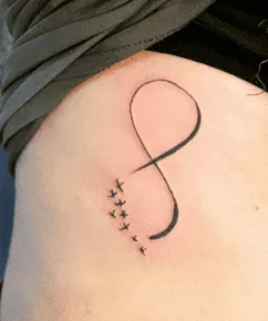 What Does the Infinity Sign Mean As A Tattoo, infinity tattoo with heart meaning, infinity symbol tattoo on wrist, infinity tattoo for women, infinity tattoo with birds meaning,