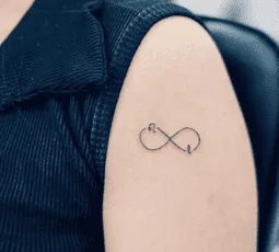 What Does the Infinity Sign Mean As A Tattoo, infinity tattoo with heart meaning, infinity symbol tattoo on wrist, infinity tattoo for women, infinity tattoo with birds meaning,