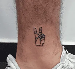 What Does A Peace Sign Tattoo Mean, Peace Sign Tattoo, Peace Sign Tattoo Ideas, Peace Sign Tattoo on fingers, Peace Sign Tattoo on Wrist,