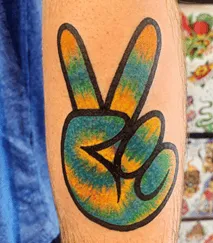 What Does A Peace Sign Tattoo Mean, Peace Sign Tattoo, Peace Sign Tattoo Ideas, Peace Sign Tattoo on fingers, Peace Sign Tattoo on Wrist,