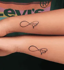 What Does the Infinity Sign Mean As A Tattoo, infinity tattoo with heart meaning, infinity symbol tattoo on wrist, infinity tattoo for women, infinity tattoo with birds meaning,