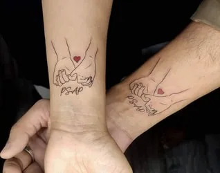 Couple Tattoo with Minimalist Lines and Shapes