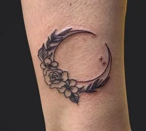 Crescent Moon Tattoo Idea8 crescent moon tattoo with flowers and leaves
