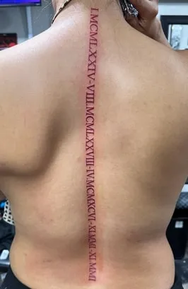 Roman Numeral Tattoo  spinal cord