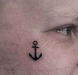 anchor tattoo under eye 