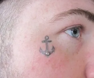 anchor tattoo under eye 