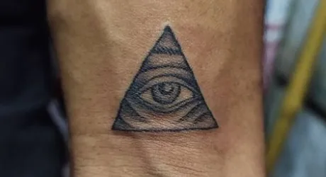 minimalist triangle eye tattoo