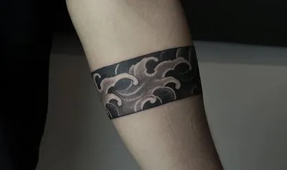 pip black band on arm tattoo idea
