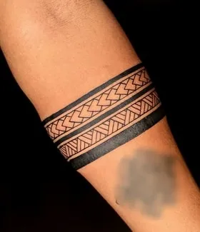geometric black band on arm tattoo idea