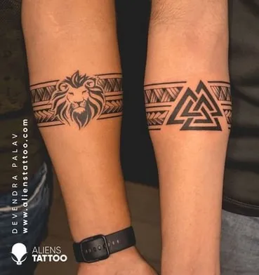 unique black band on arm tattoo idea