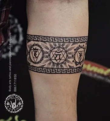 mandala black band on arm tattoo idea