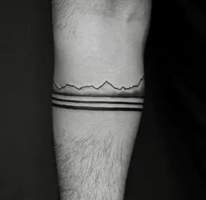 minimal black band on arm tattoo idea