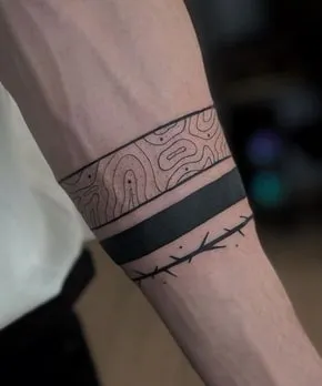 black band on arm tattoo meaning 3