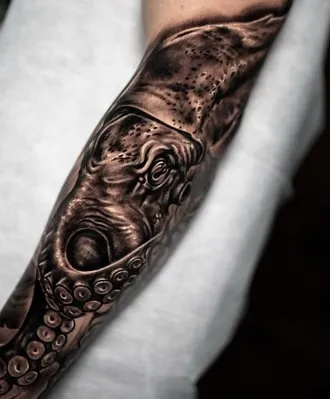 healed black kraken tattoo 