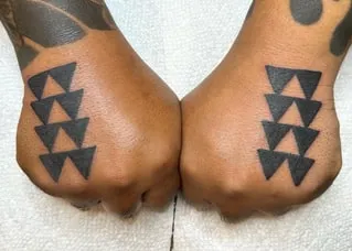 history of shark tooth tattoo