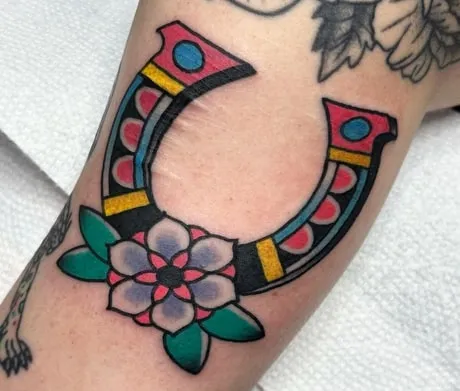 horseshoe tattoo design idea flowers