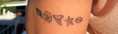 cute shark tooth tattoo idea