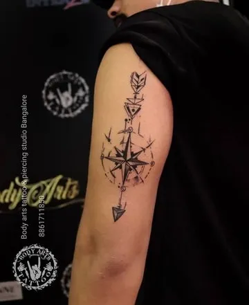 tricep compass tattoo design 