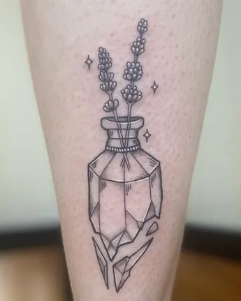 Geometric vase with flowers tattoo Idea