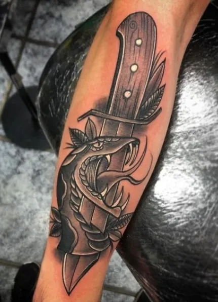 biomechanical knife with a snake tattoo biomechanical knife with a snake tattoo