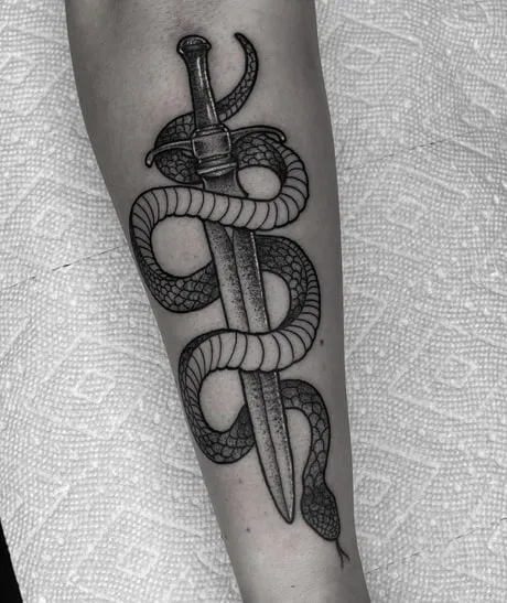 black and gray knife with a snake tattoo black and gray knife with a snake tattoo