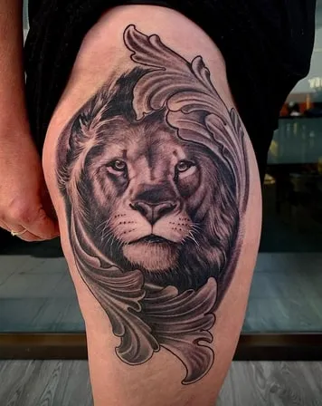 leaves and lion tattoo design
