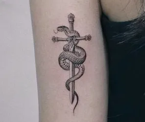minimal knife with a snake tattoo