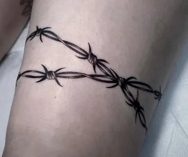 what does a barbed wire tattoo mean?