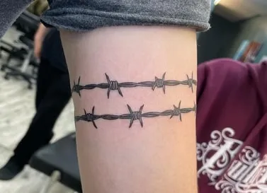 what does a barbed wire tattoo mean