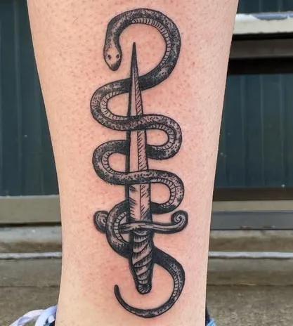 what is the meaning of a knife with a snake tattoo 2 what is the meaning of a knife with a snake tattoo