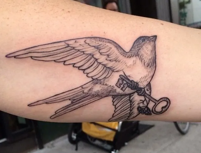 bird with keys tattoo meaning