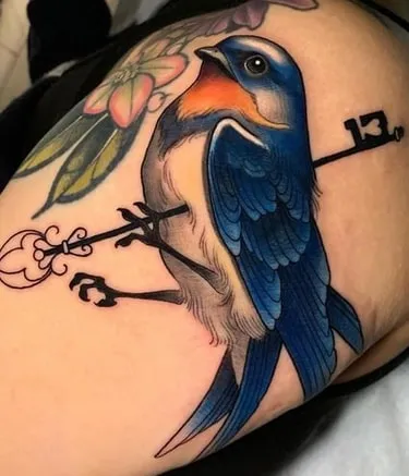 bird with keys tattoo symboilism