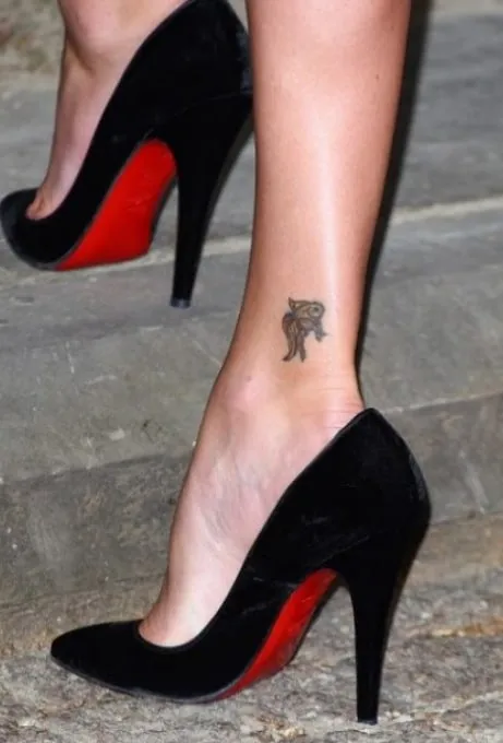 charlize theron koi tattoo