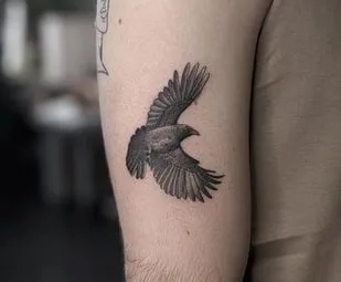 small crow tattoo design for guys
