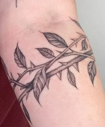 vine with thorns tattoo