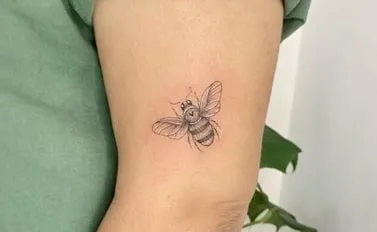 minimalist bee tattoo