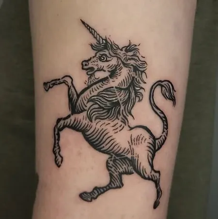 black lines unicorn tattoo