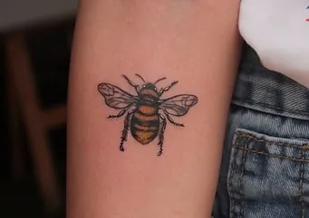 what does a tattoo of a bee symbolize
