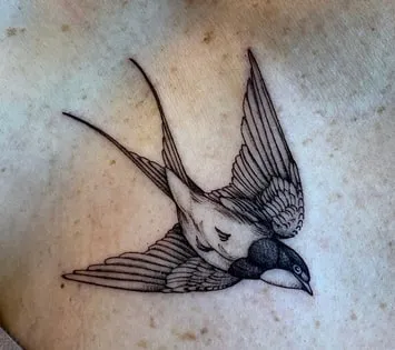 flying sparrow tattoo idea