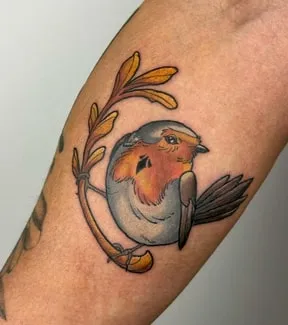 perched robin tattoo design